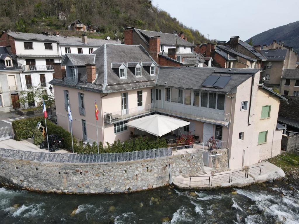 an aerial view of a house next to the water at LE 41 AVENUE FOCH in Luchon