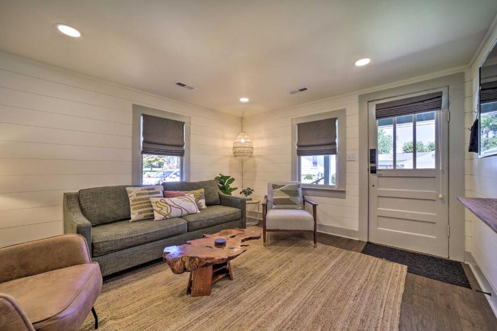 a living room with a couch and a table at Updated Brevard Home - Close to Downtown! in Brevard