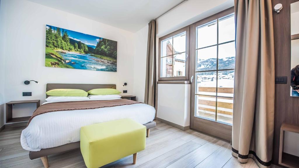 A bed or beds in a room at Chalet 4 Stagioni