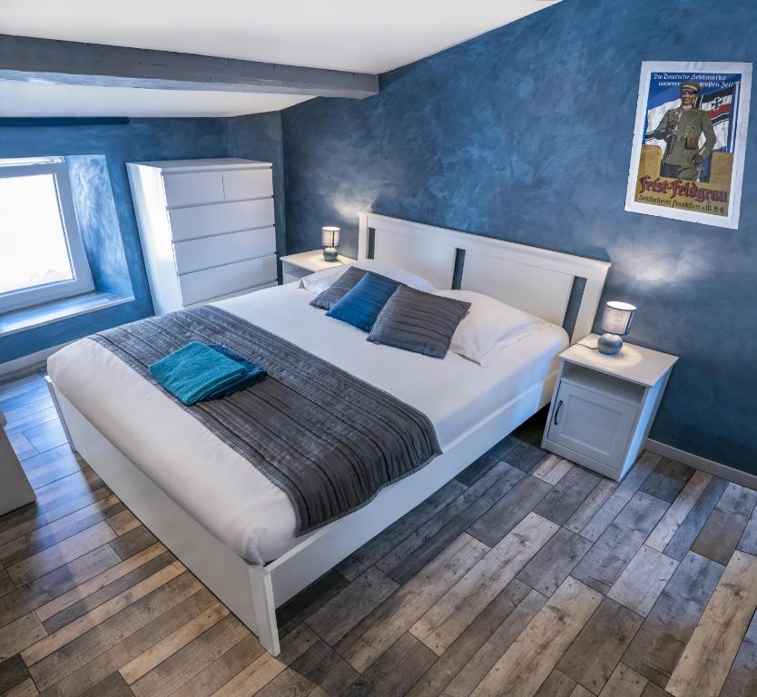 Postel nebo postele na pokoji v ubytování Gîte chez Thomas et John