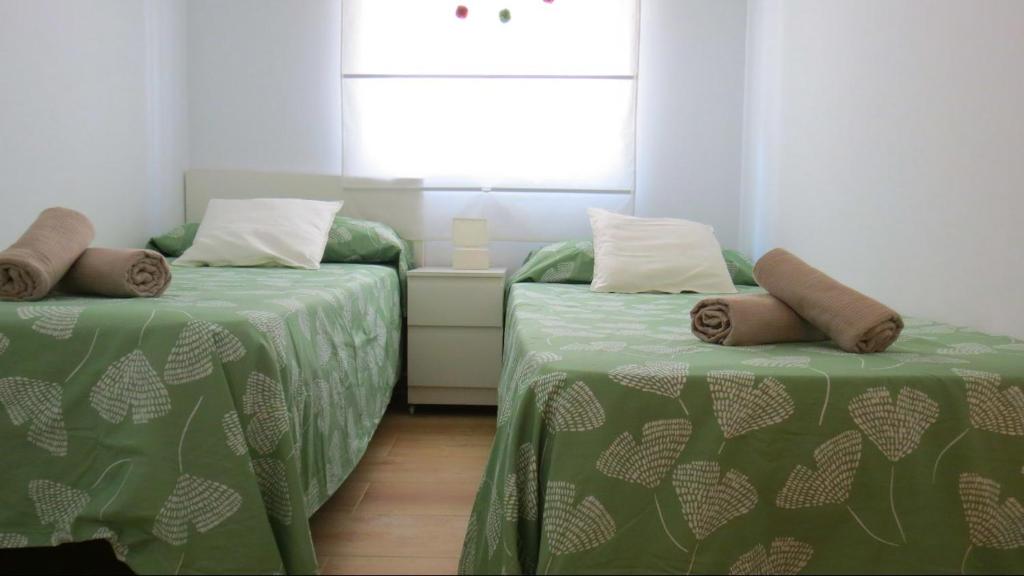 A bed or beds in a room at Apartamento Casa Mozárabe