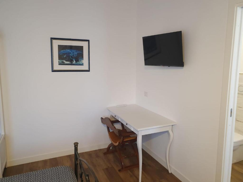 TV a/nebo společenská místnost v ubytování Agriturismo Casa Chiara