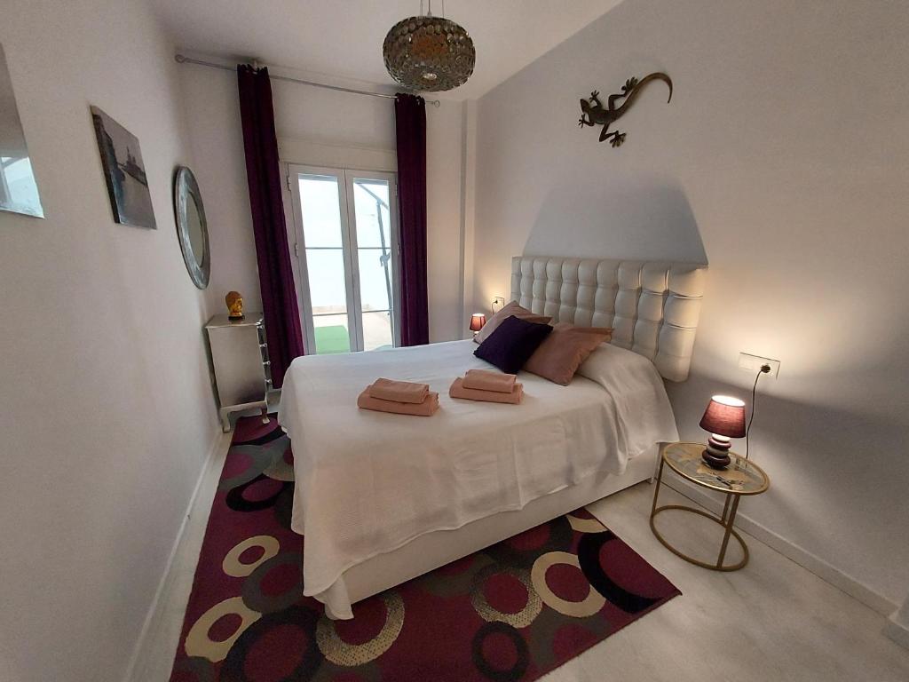 Posteľ alebo postele v izbe v ubytovaní Apartamento Nicolasa