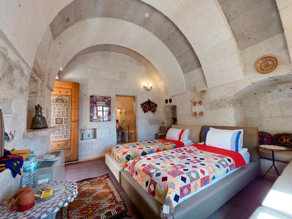 Postel nebo postele na pokoji v ubytování Pigeon Hotel Cappadocia