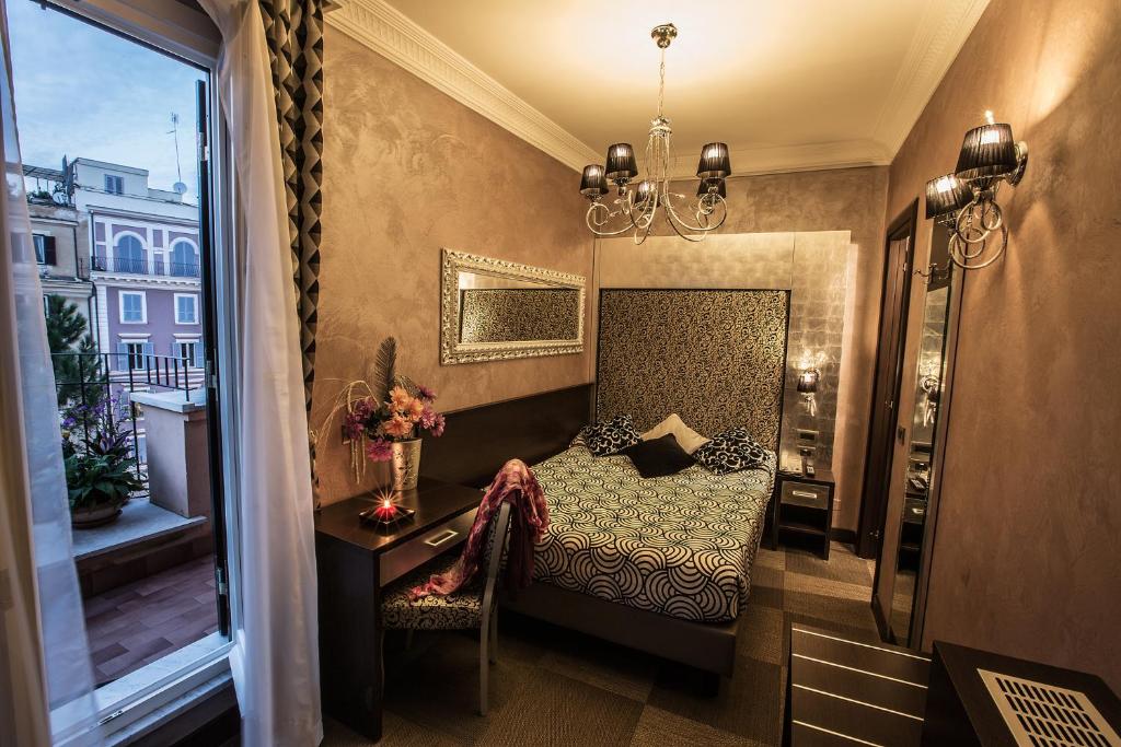 Postel nebo postele na pokoji v ubytování Hotel Romano