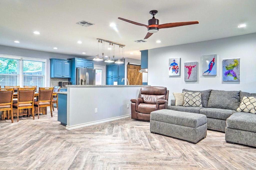 a living room with a couch and a dining room at Lovely Lubbock Home with Furnished Patio and Yard in Lubbock