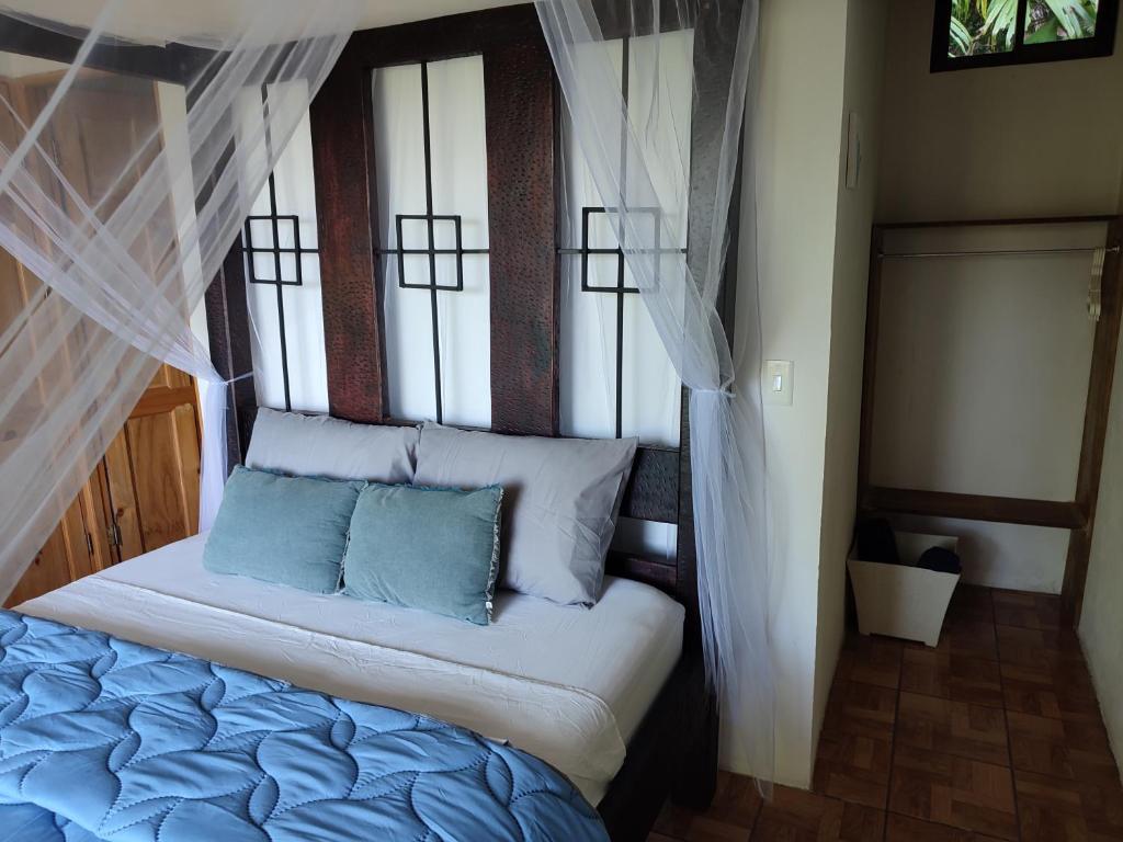 Postel nebo postele na pokoji v ubytování Villas In Sueño Private Jungle Hotel