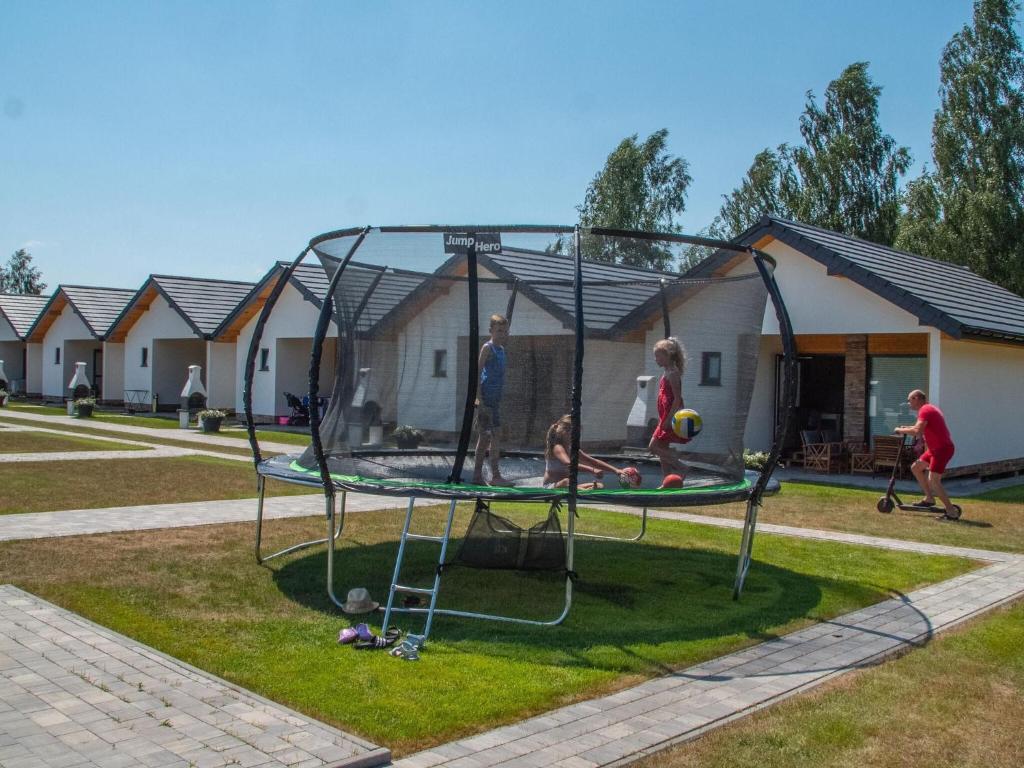a group of people playing on a trampoline at Cottages close to the sea, Wicie near Jaros awiec in Wicie