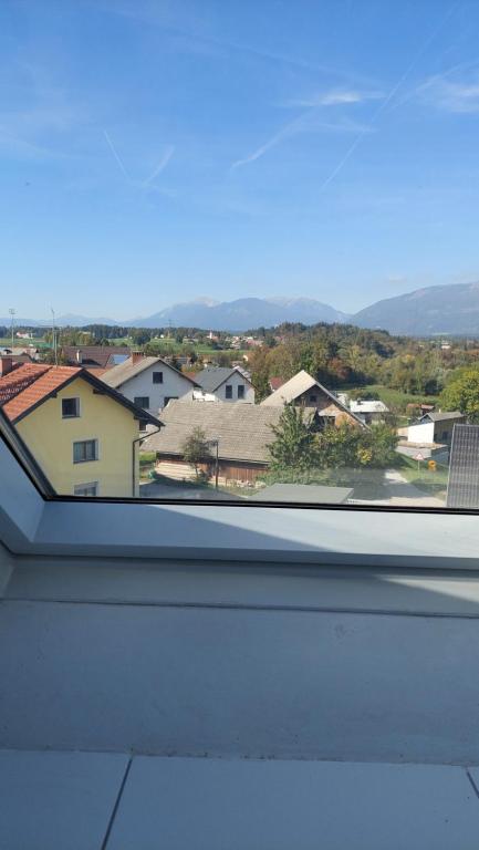 a window with a view of a city at Apartma Samo in Kranj