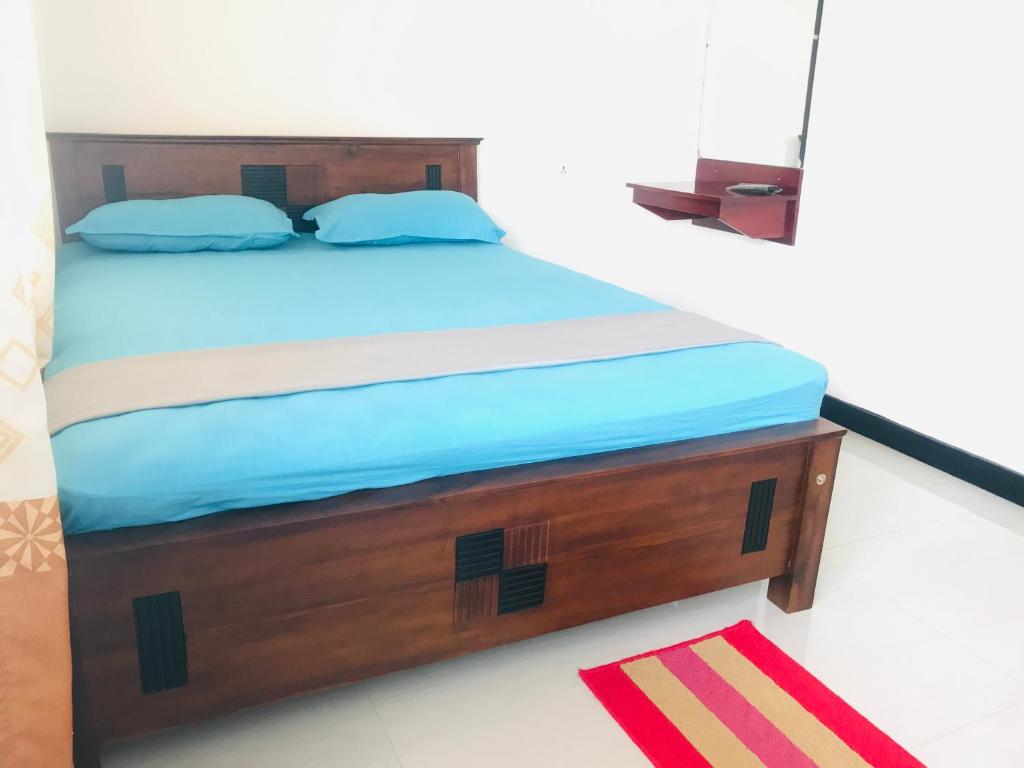 Postel nebo postele na pokoji v ubytování Hotel Ganthera Kataragama