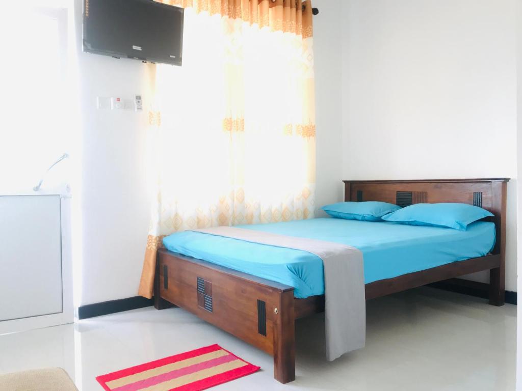 Postel nebo postele na pokoji v ubytování Hotel Ganthera Kataragama
