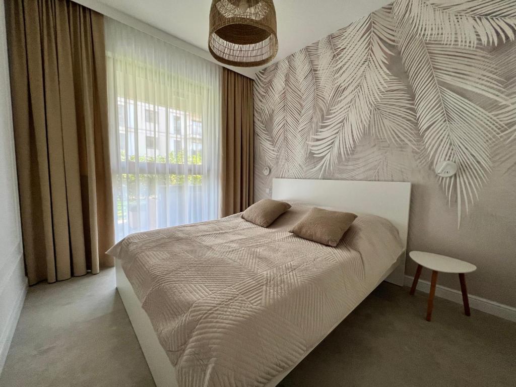 Postel nebo postele na pokoji v ubytování Apartament na Gdańskiej