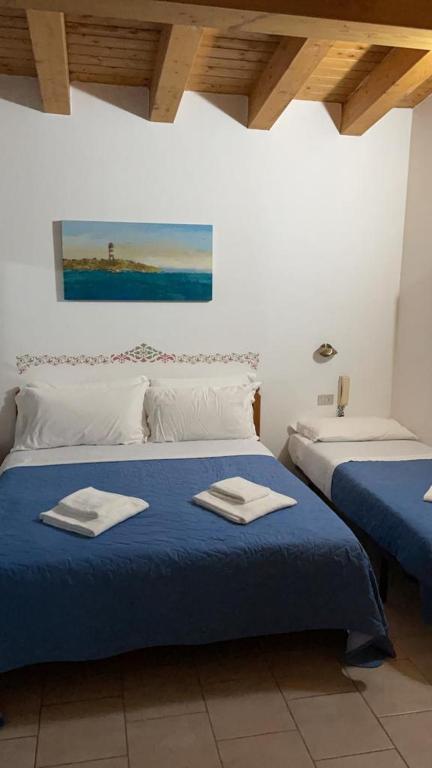 Postel nebo postele na pokoji v ubytování Hotel Garni Tosca