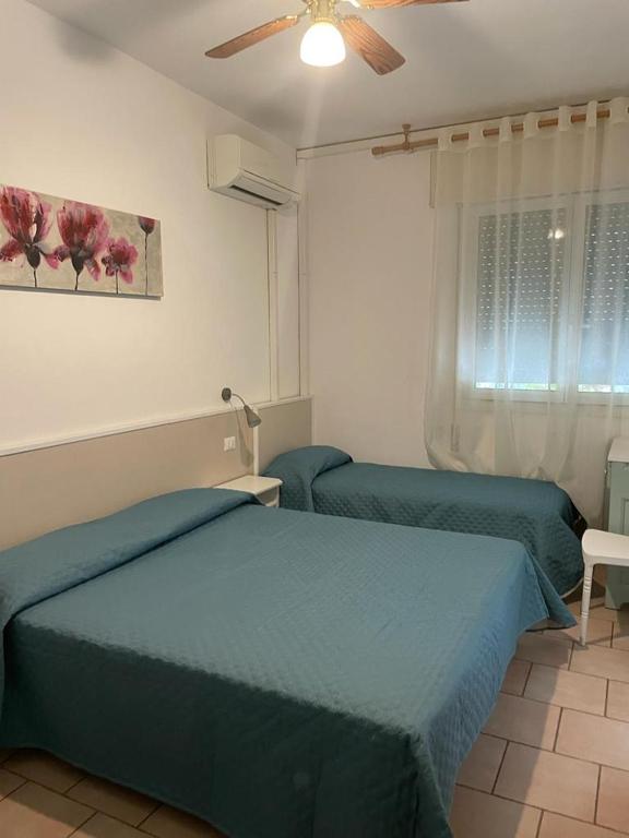 Postel nebo postele na pokoji v ubytování Hotel Garni Tosca