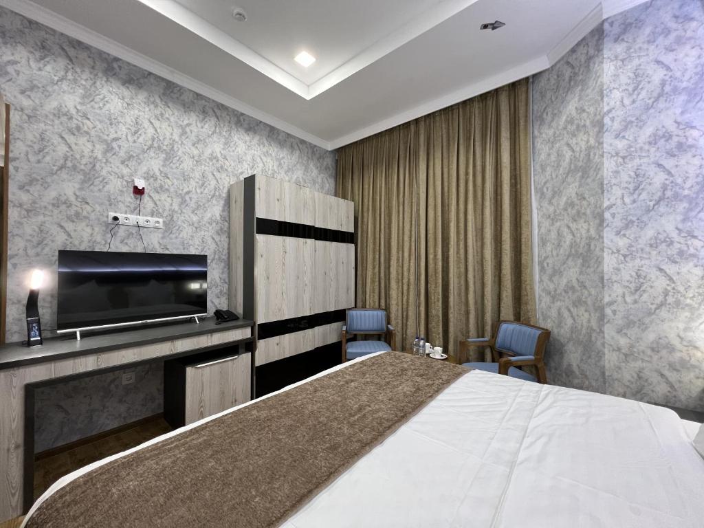 Postel nebo postele na pokoji v ubytování Ada Hotel