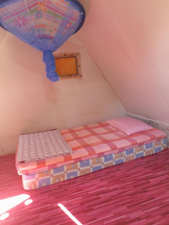 Postel nebo postele na pokoji v ubytování KK Hut