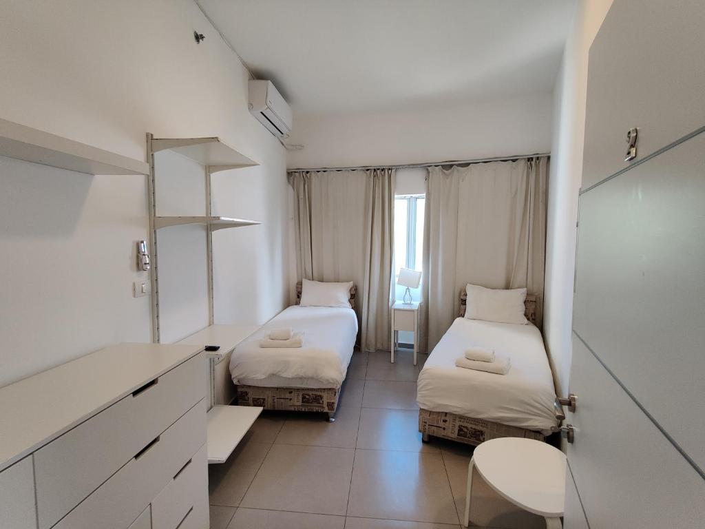 Postel nebo postele na pokoji v ubytování Begin19 Apartments & Hostel