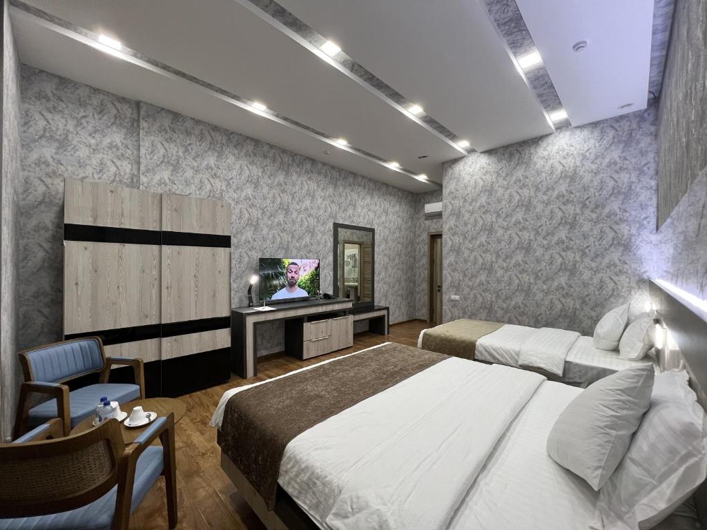Postel nebo postele na pokoji v ubytování Ada Hotel