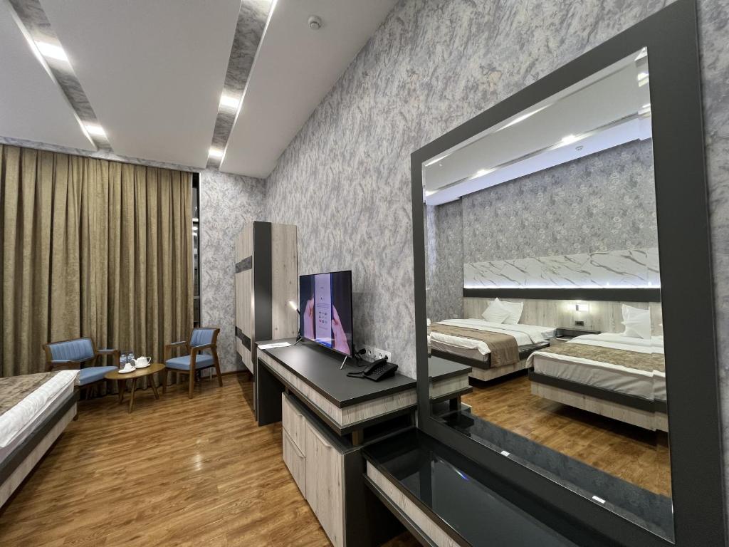 Postel nebo postele na pokoji v ubytování Ada Hotel