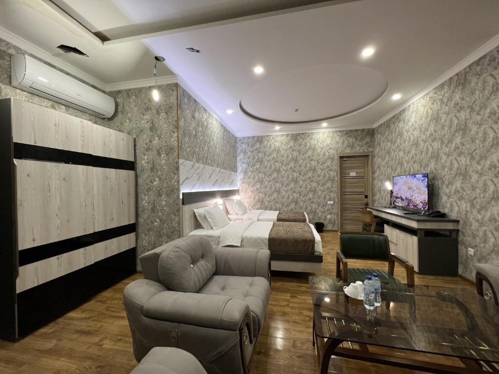 Postel nebo postele na pokoji v ubytování Ada Hotel