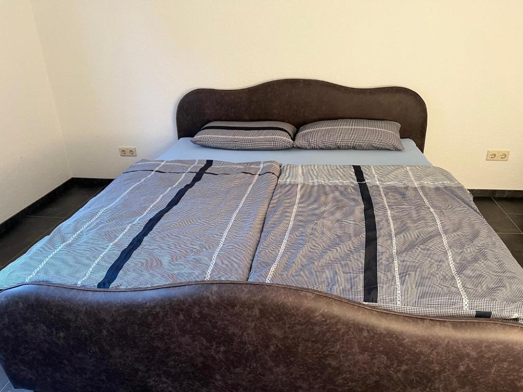 Postel nebo postele na pokoji v ubytování Wiehengebirgs Fernblick App1