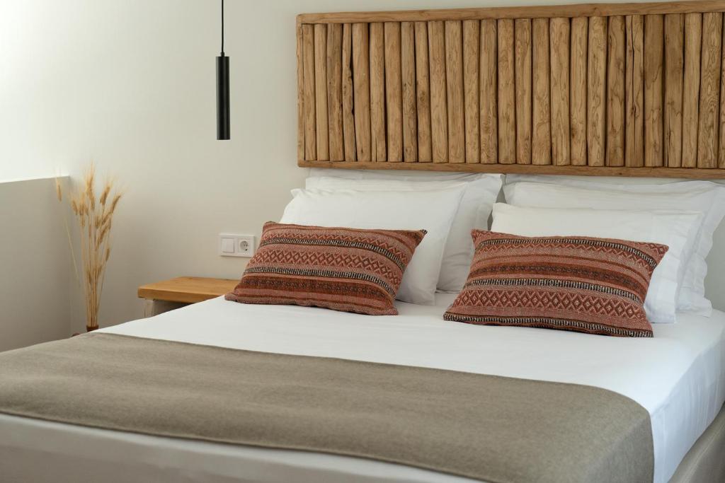 A bed or beds in a room at Triantafilia Guesthouse