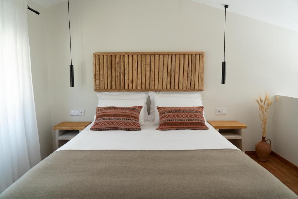 A bed or beds in a room at Triantafilia Guesthouse