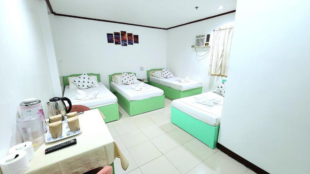 Postel nebo postele na pokoji v ubytování Demiren Hotel