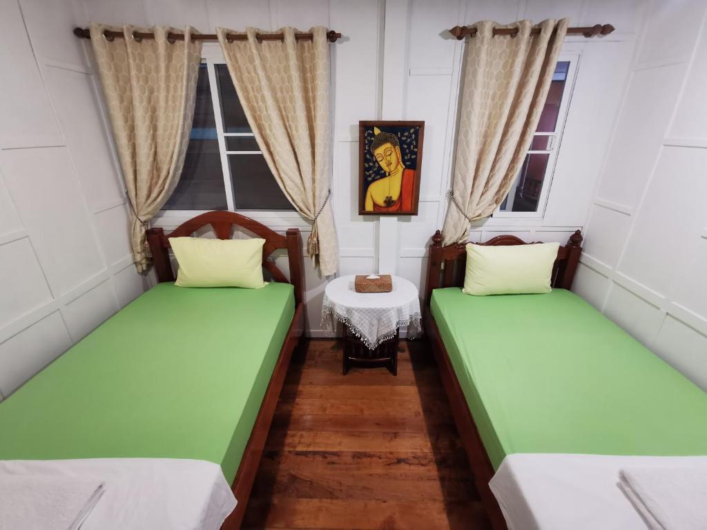 Postel nebo postele na pokoji v ubytování TAVEE Guesthouse