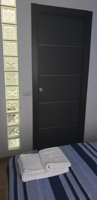 A bed or beds in a room at Monteceneri 9 B&b