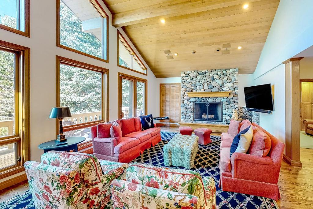 a living room with two couches and a fireplace at Baldy View Lodge in Ketchum