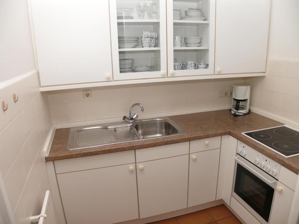 Kuchyň nebo kuchyňský kout v ubytování Haus Nordseeresidenz Wohnung 35