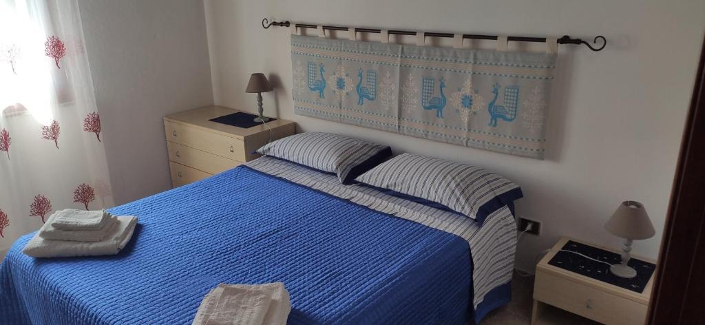 Posteľ alebo postele v izbe v ubytovaní Casa Minicapo Mandriola