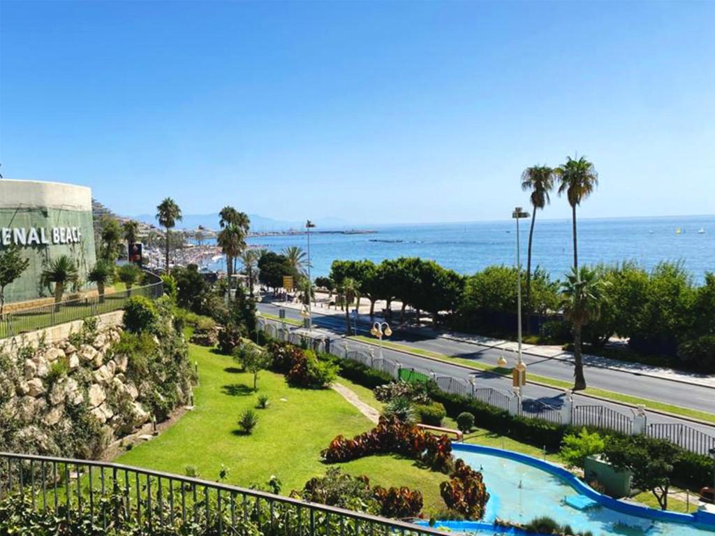 an aerial view of a park next to the ocean at BenalBeach Residential in Benalmádena