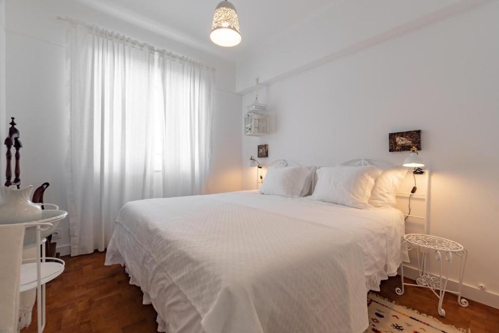 Postel nebo postele na pokoji v ubytování Casa da Avó Bia