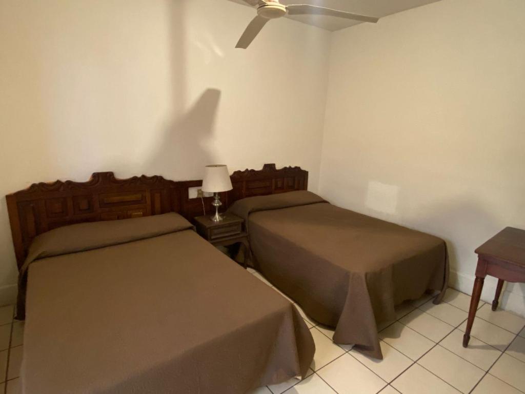 Postel nebo postele na pokoji v ubytování HOTEL MAYA IXTLAN