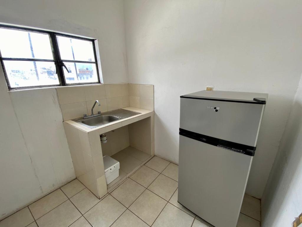 Kuchyň nebo kuchyňský kout v ubytování HOTEL MAYA IXTLAN