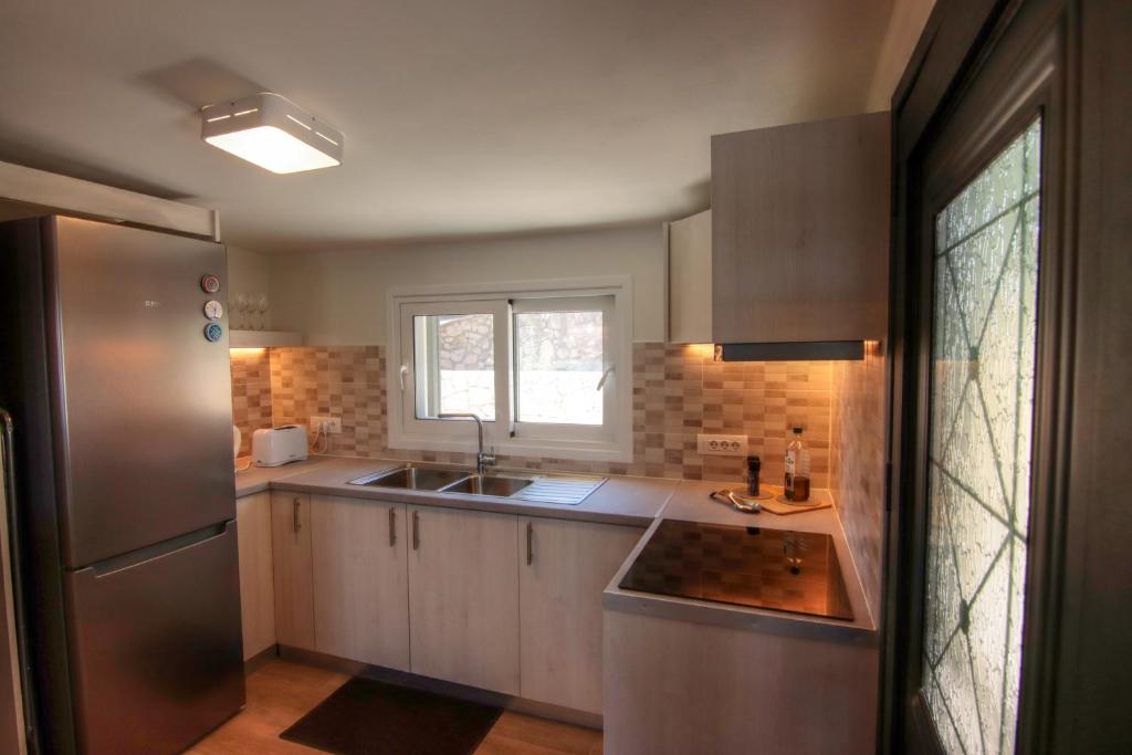 Kuchyň nebo kuchyňský kout v ubytování Fiskardo Beach House