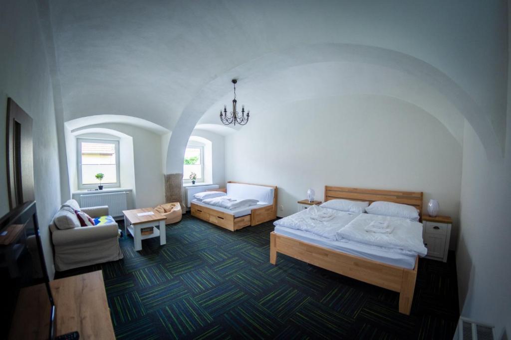 Voodi või voodid majutusasutuse Penzion Nežárka 59 toas