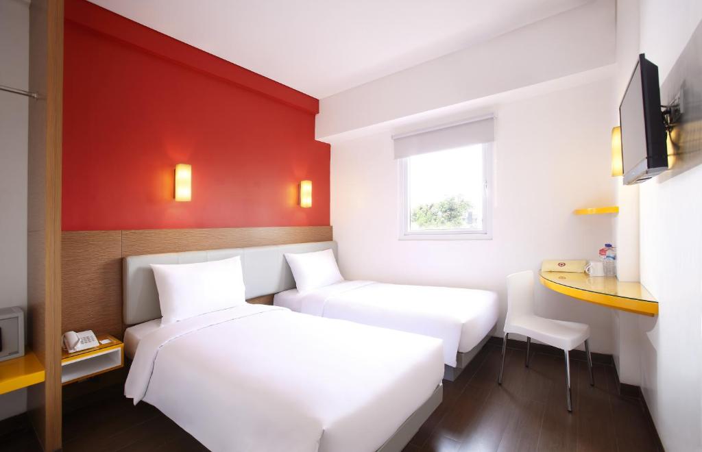 Postel nebo postele na pokoji v ubytování Amaris Hotel Cilegon