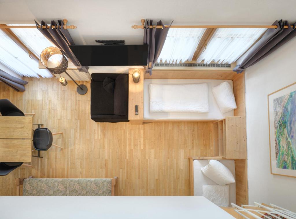 Postel nebo postele na pokoji v ubytování Center Rooms & Apartments