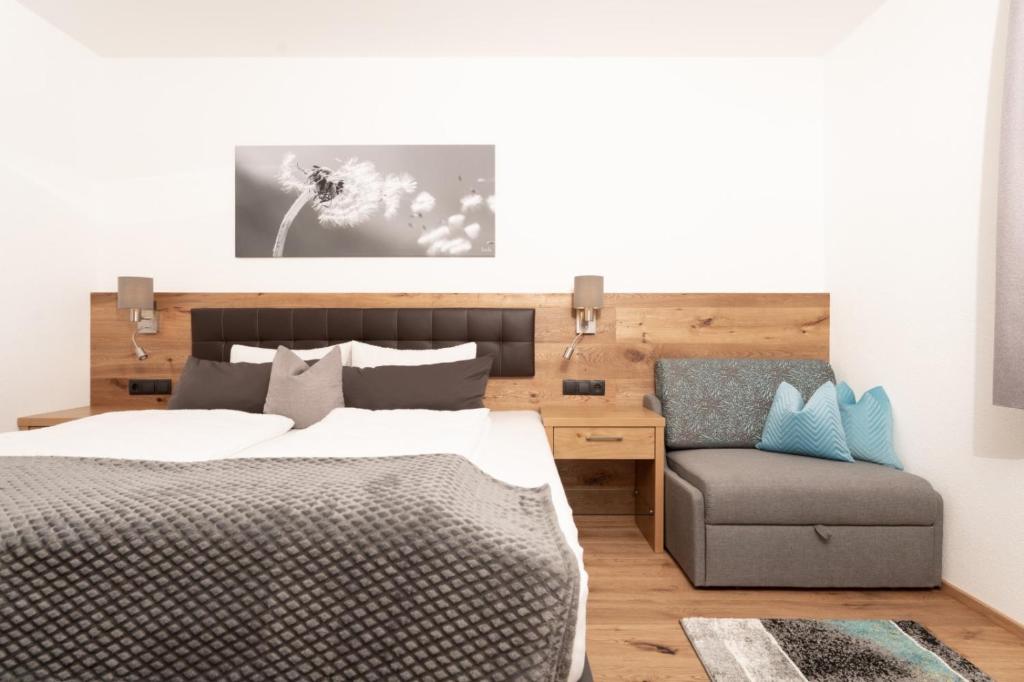 Postel nebo postele na pokoji v ubytování Alpenchalet Oetztal