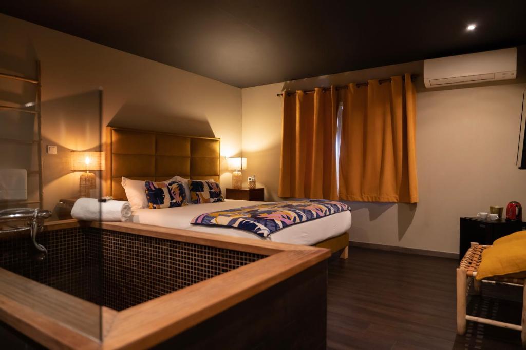 a bedroom with a bed and a window at Palm Beach in Ajaccio
