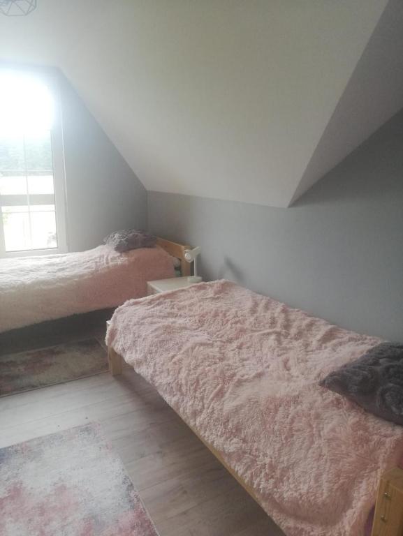 Posteľ alebo postele v izbe v ubytovaní Chata Nova