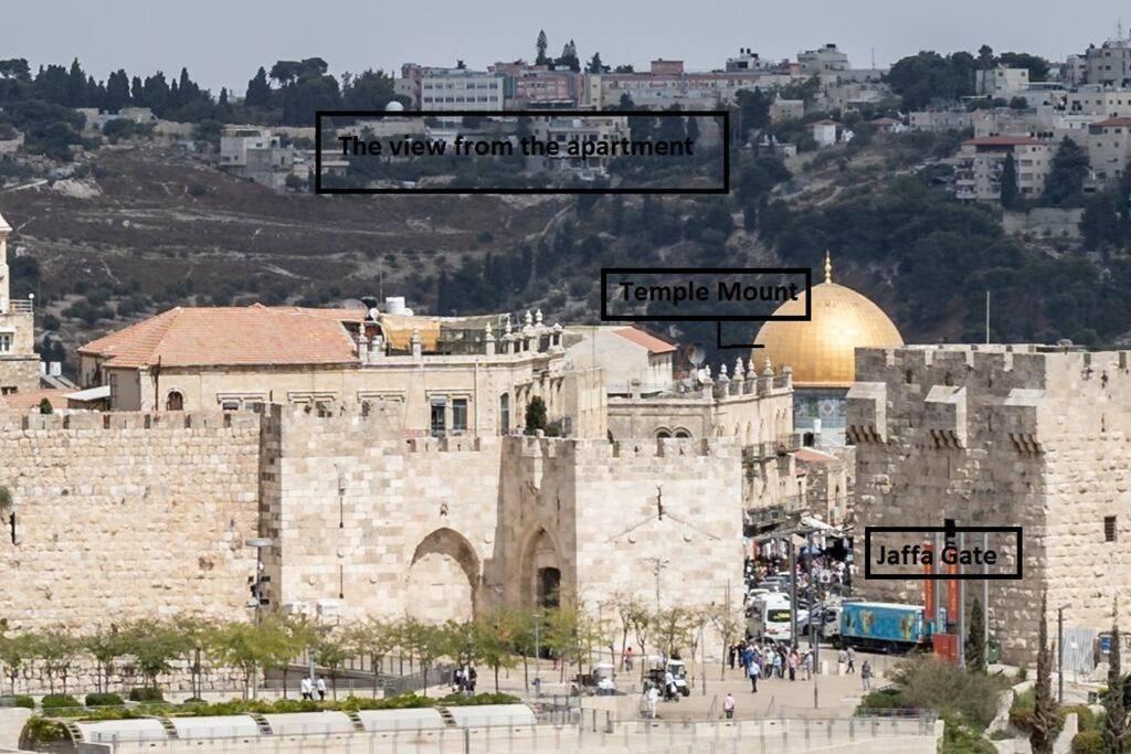 a view of the old city of jerusalem with a sign at King David Penthouse with private pool in Jerusalem