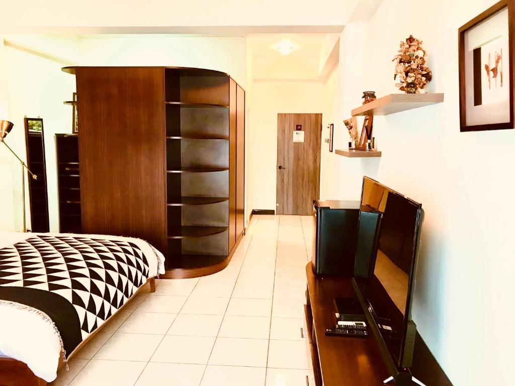 Postel nebo postele na pokoji v ubytování Grace Homestay