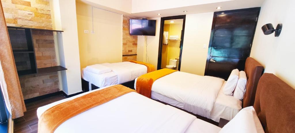 Postel nebo postele na pokoji v ubytování Hotel Raices Machupicchu