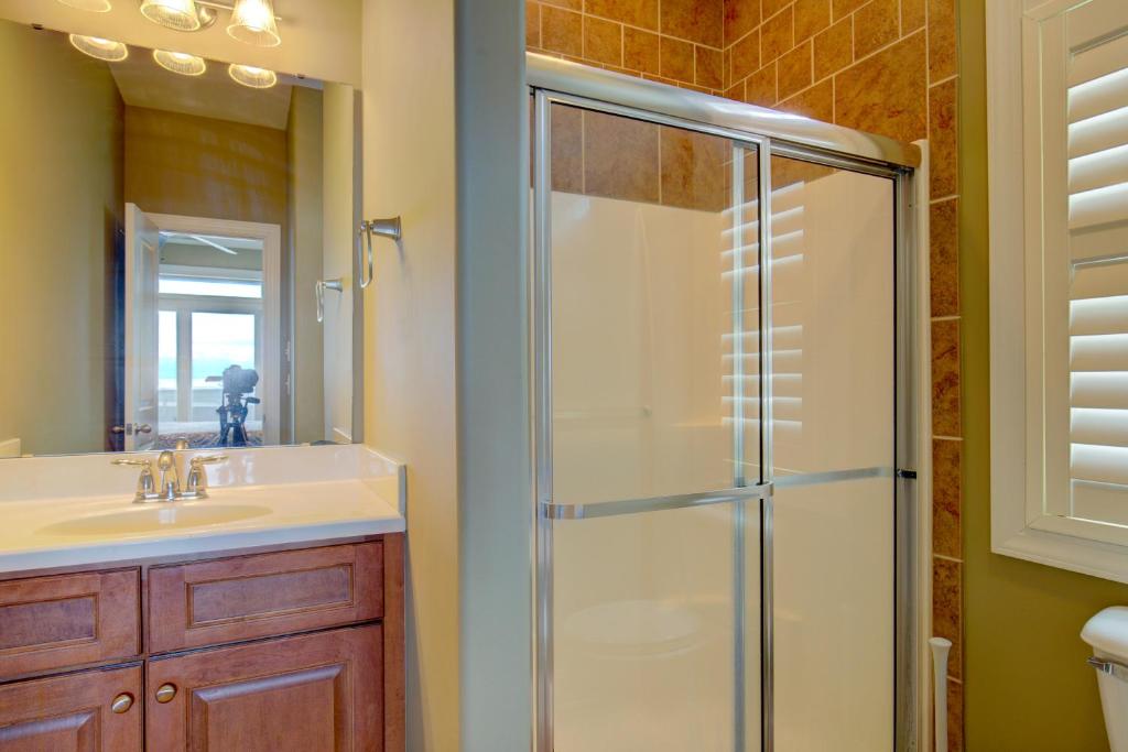 a bathroom with a shower and a sink at The Lazy Beagle in North Topsail Beach