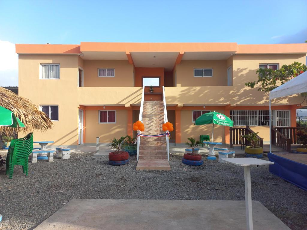 a playground in front of a building at Rancho el novato in Concepción de La Vega