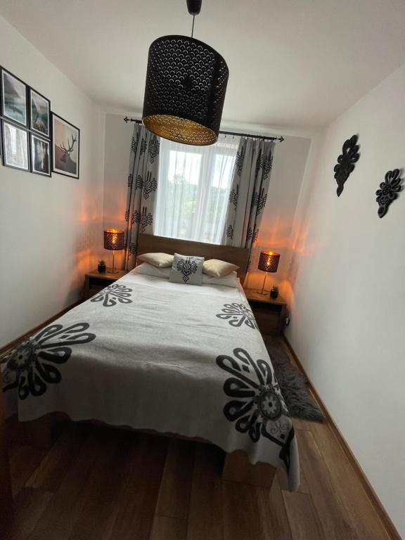 Posteľ alebo postele v izbe v ubytovaní Apartament Krupówki Centrum